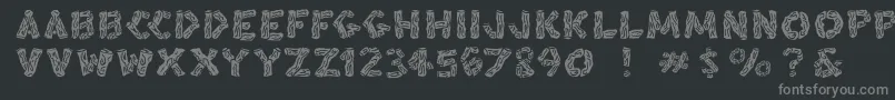 Fonte Blacksplinters – fontes cinzas em um fundo preto