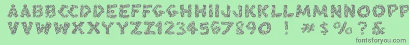 Blacksplinters Font – Gray Fonts on Green Background