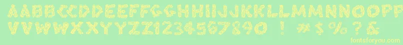 Blacksplinters Font – Yellow Fonts on Green Background