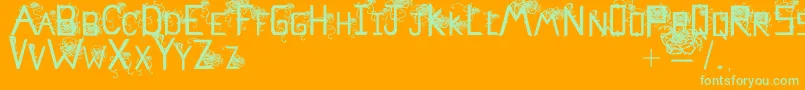 Flowerscube-Schriftart – Grüne Schriften auf orangefarbenem Hintergrund