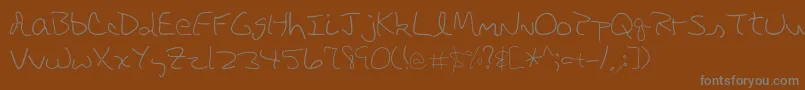 Czcionka DbeRigel – szare czcionki na brązowym tle