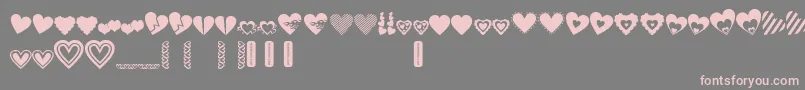 LovesDevine-Schriftart – Rosa Schriften auf grauem Hintergrund