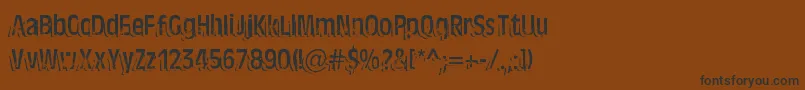 TenTonBallyhoo-Schriftart – Schwarze Schriften auf braunem Hintergrund