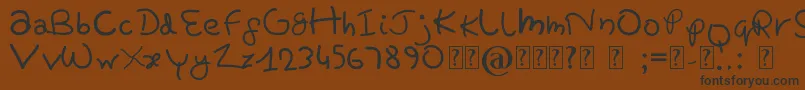 PrettyTomato-Schriftart – Schwarze Schriften auf braunem Hintergrund