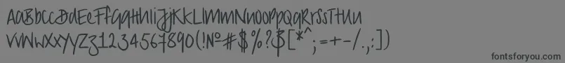 フォントStrongscript – 黒い文字の灰色の背景