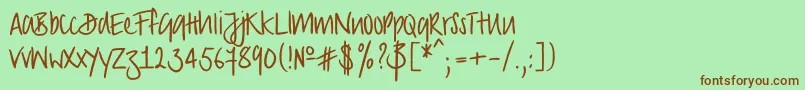 Czcionka Strongscript – brązowe czcionki na zielonym tle