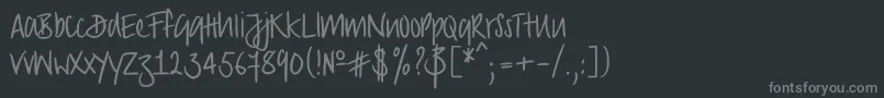 Strongscript-fontti – harmaat kirjasimet mustalla taustalla