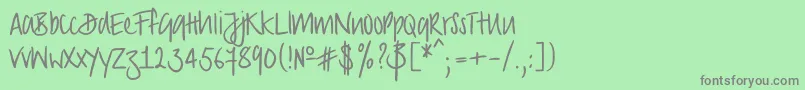 Strongscript-Schriftart – Graue Schriften auf grünem Hintergrund