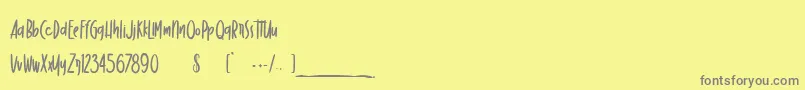 DancingMarker Font – Gray Fonts on Yellow Background
