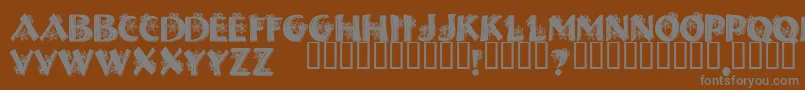 HalloweenSpider-fontti – harmaat kirjasimet ruskealla taustalla