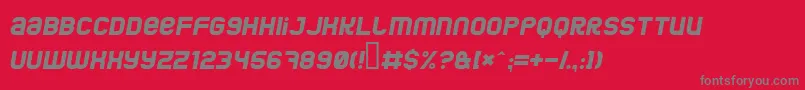 JumboItalic-fontti – harmaat kirjasimet punaisella taustalla