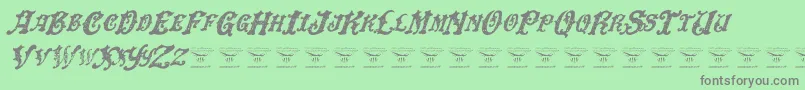 DinglehuckleberryItalic-Schriftart – Graue Schriften auf grünem Hintergrund