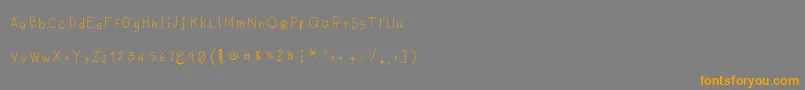 フォントLyemuelookkreung2 – オレンジの文字は灰色の背景にあります。