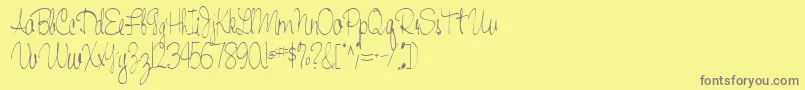 Handwriting53Regular-fontti – harmaat kirjasimet keltaisella taustalla