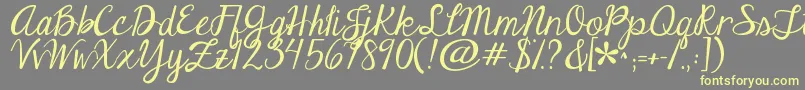 Jandaeleganthandwriting Font – Yellow Fonts on Gray Background