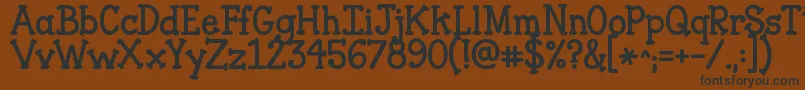 Jandaclosertofree Font – Black Fonts on Brown Background