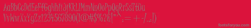 JuiceItcTt-Schriftart – Graue Schriften auf rotem Hintergrund