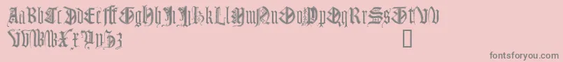フォントMonugd – ピンクの背景に灰色の文字