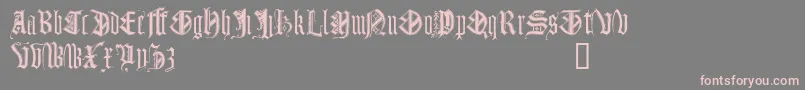 Monugd-Schriftart – Rosa Schriften auf grauem Hintergrund
