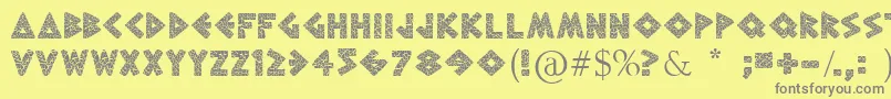 フォントGreekToMe – 黄色の背景に灰色の文字