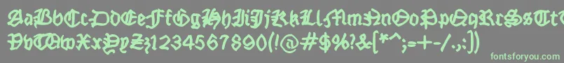 フォントFraktsketchfs – 灰色の背景に緑のフォント