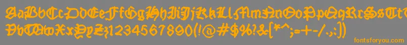 フォントFraktsketchfs – オレンジの文字は灰色の背景にあります。