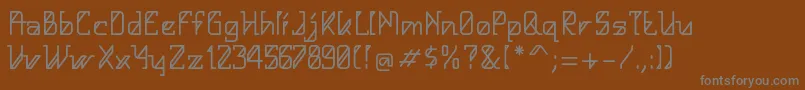HelloAlpha-fontti – harmaat kirjasimet ruskealla taustalla