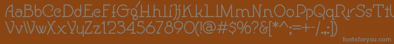 Speedballno1nf-fontti – harmaat kirjasimet ruskealla taustalla