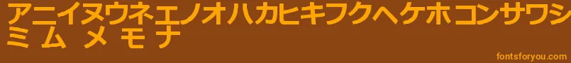 フォントKatakanaTfb – オレンジ色の文字が茶色の背景にあります。