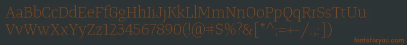 Шрифт TangerserifmediumulLight – коричневые шрифты на чёрном фоне