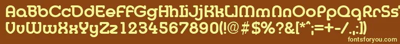 Desireebeckermedium-fontti – keltaiset fontit ruskealla taustalla