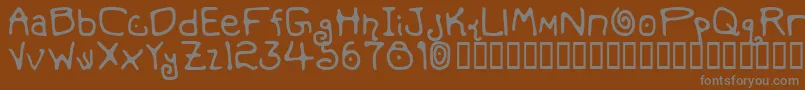 フォントMondmfb – 茶色の背景に灰色の文字