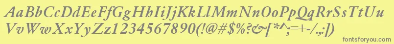 GaramondMediumItalic-fontti – harmaat kirjasimet keltaisella taustalla