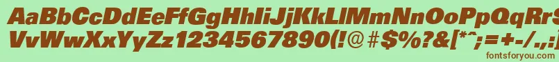 Fonte UltimateserialHeavyItalic – fontes marrons em um fundo verde