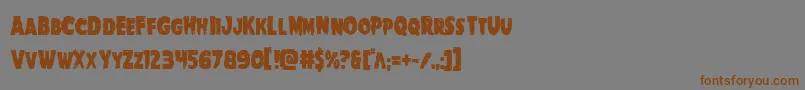 フォントGoblincreekcond – 茶色の文字が灰色の背景にあります。