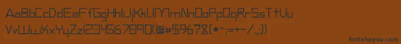 フォントAndromedatv – 黒い文字が茶色の背景にあります