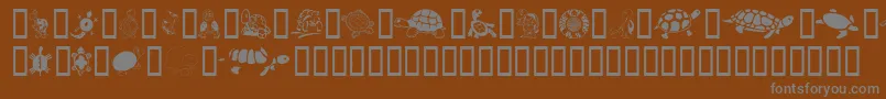 KeyasTurtles-fontti – harmaat kirjasimet ruskealla taustalla