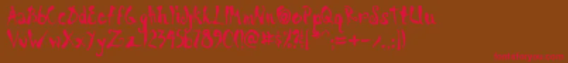 フォントScrawnCyrAoe – 赤い文字が茶色の背景にあります。
