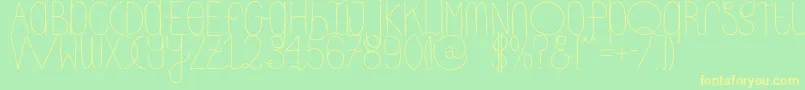 DhdskinnyRegular Font – Yellow Fonts on Green Background