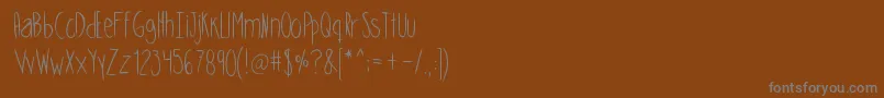 Шрифт Skinnycookies – серые шрифты на коричневом фоне