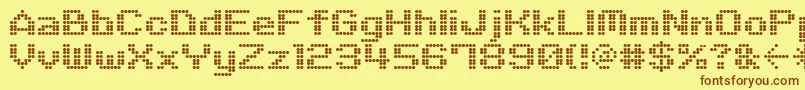 M06Quadra-fontti – ruskeat fontit keltaisella taustalla