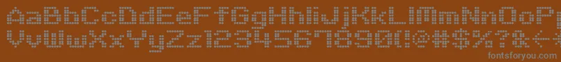 フォントM06Quadra – 茶色の背景に灰色の文字