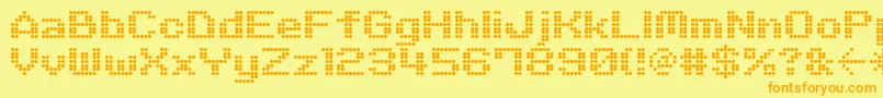 M06Quadra-fontti – oranssit fontit keltaisella taustalla