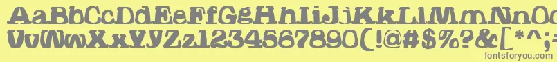 フォントHodadWarpedOne – 黄色の背景に灰色の文字