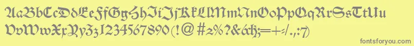 AlsheimdbNormal-fontti – harmaat kirjasimet keltaisella taustalla