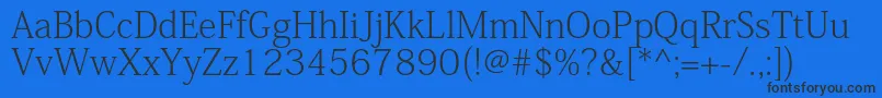 フォントKozminproExtralight – 黒い文字の青い背景