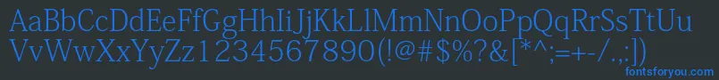 Шрифт KozminproExtralight – синие шрифты на чёрном фоне
