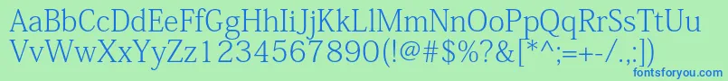 KozminproExtralight Font – Blue Fonts on Green Background