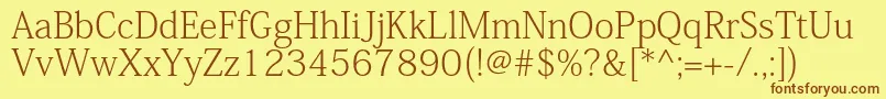 KozminproExtralight Font – Brown Fonts on Yellow Background