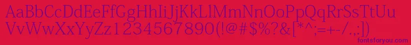 KozminproExtralight Font – Purple Fonts on Red Background